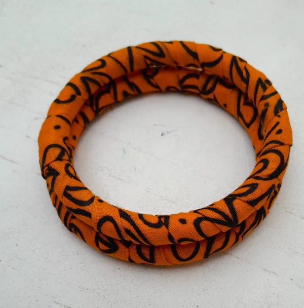 Orange and Black African fabric and brass bangles by Jumandy Fabrics at Amanartis at the Atria by Amma Gyan 2