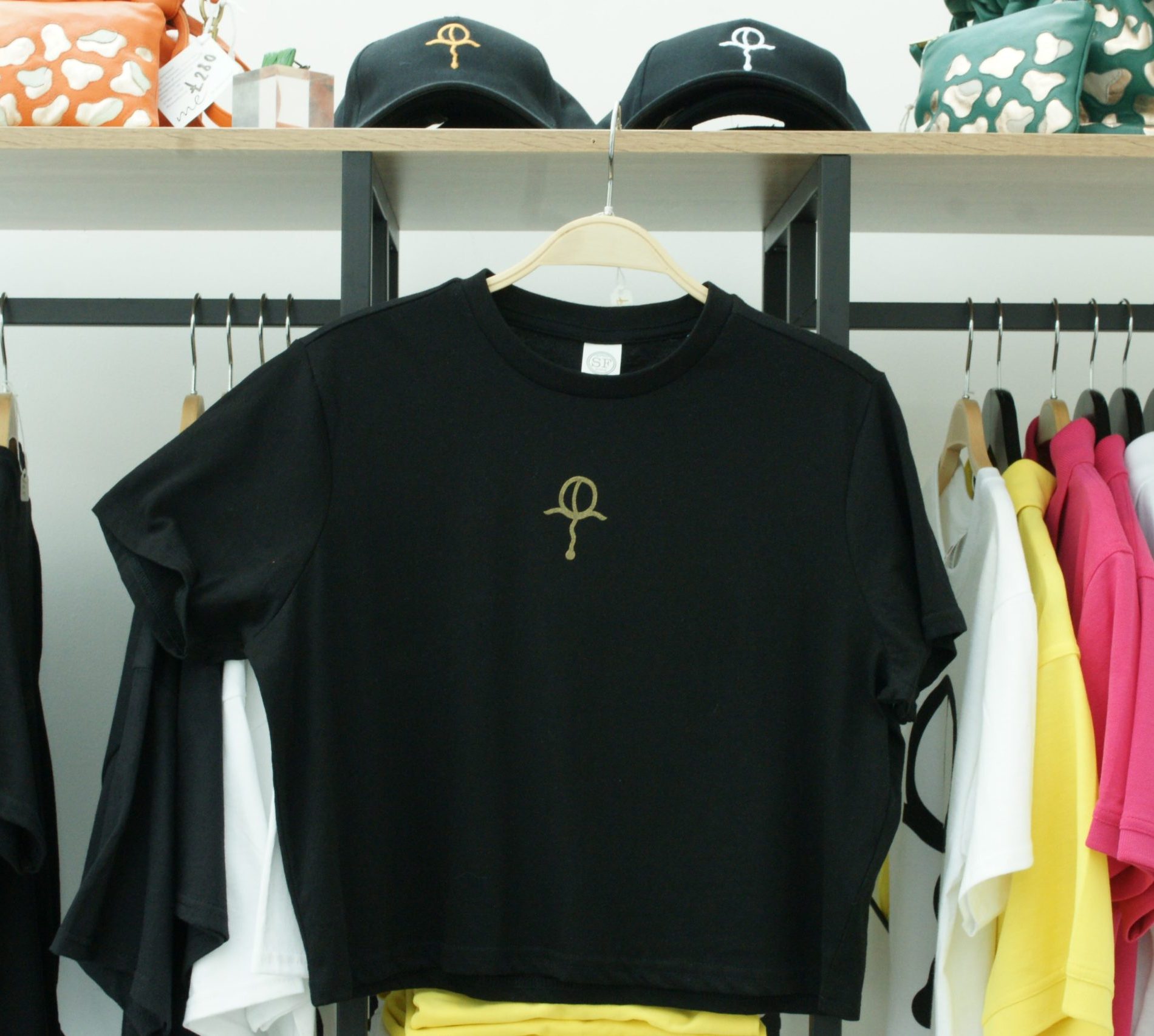 Small gold gratitude print on cropped black tee by Amma Gyan for Amma Gyan at the House of Amma by Founder Amma Gyan